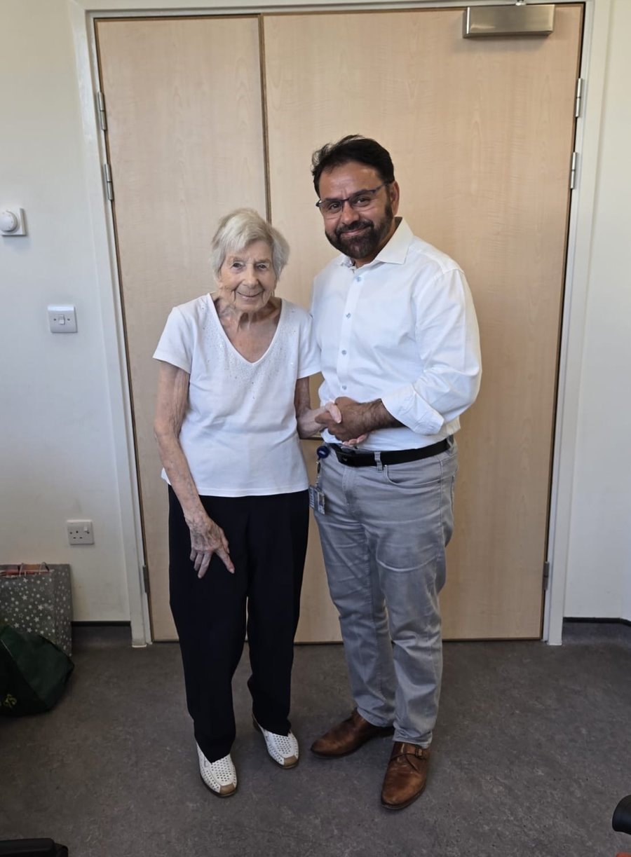 Doreen standing with Mr Shakir Hussain at her 18-month follow-up after total hip replacement at the Royal Orthopaedic Hospital