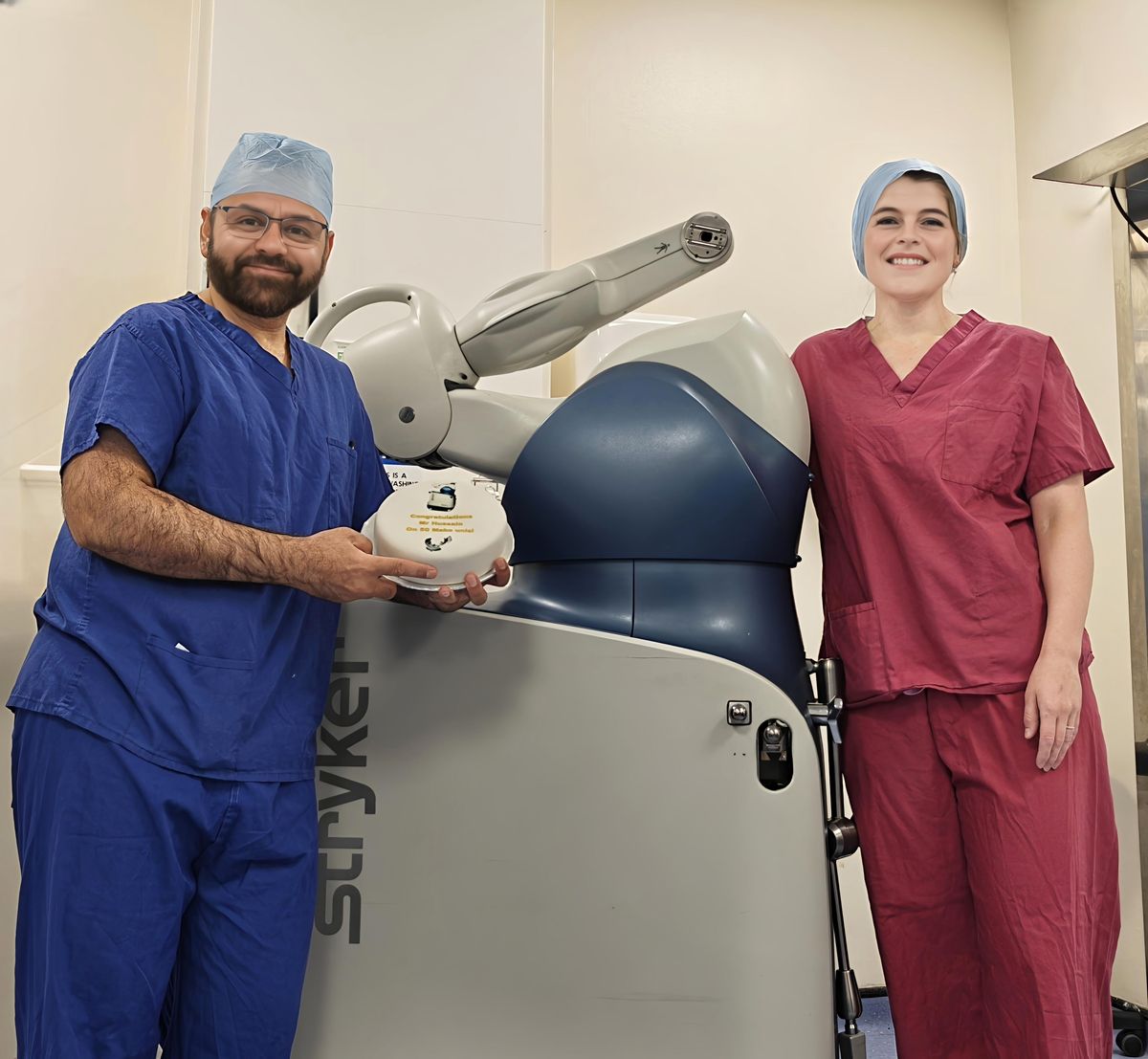 Mr Shakir Hussain with the Stryker MAKO robotic arm used for robotic knee replacement in Birmingham