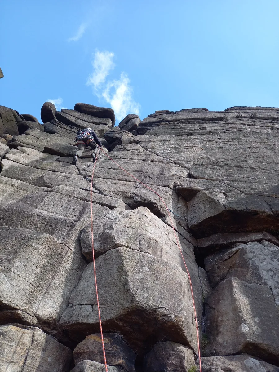 Mr Shakir Hussain's patient rock climbing on outdoor grit, lead climbing on a multi-pitch route, after Birmingham Hip Resurfacing surgery